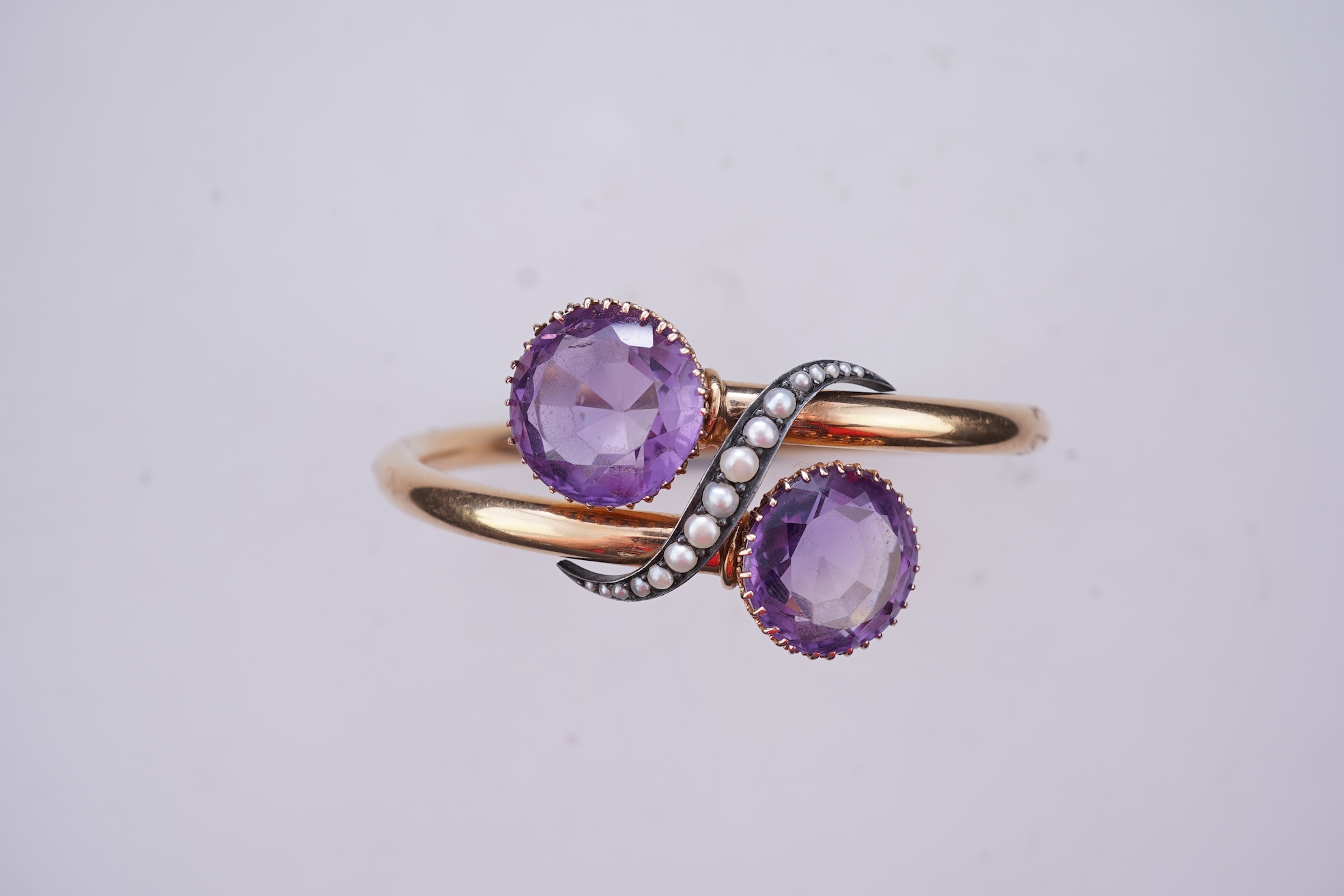A Victorian gold, pearl and amethyst bangle, late 19th century